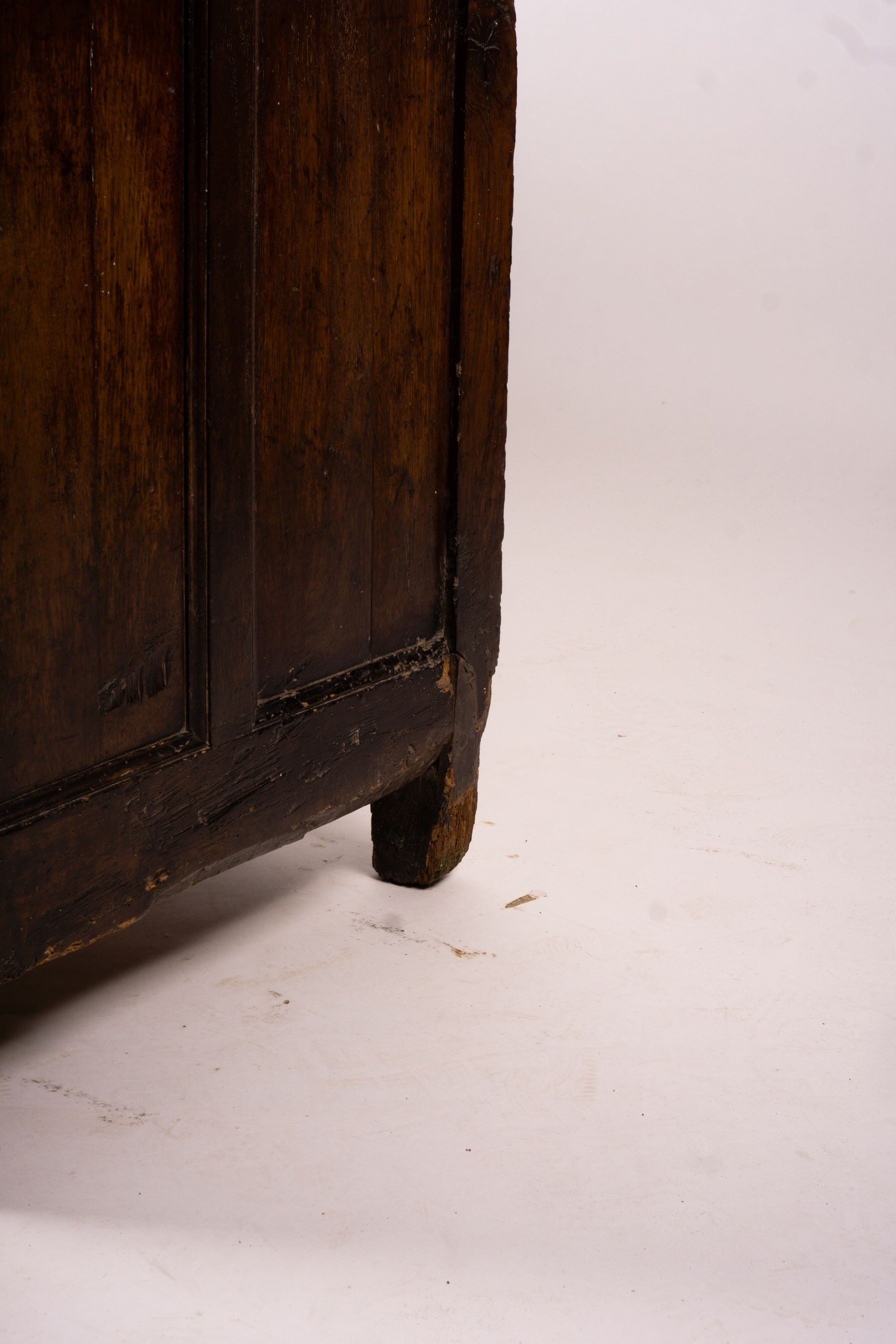 An 18th century panelled oak mule chest, length 161cm, depth 61cm, height 84cm